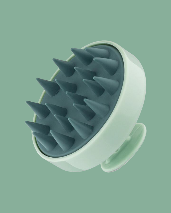 Sienna Naturals Scalp Clearing Massager on a green background.